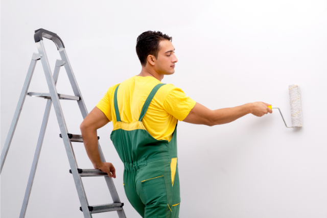 Worker Painting the Wall